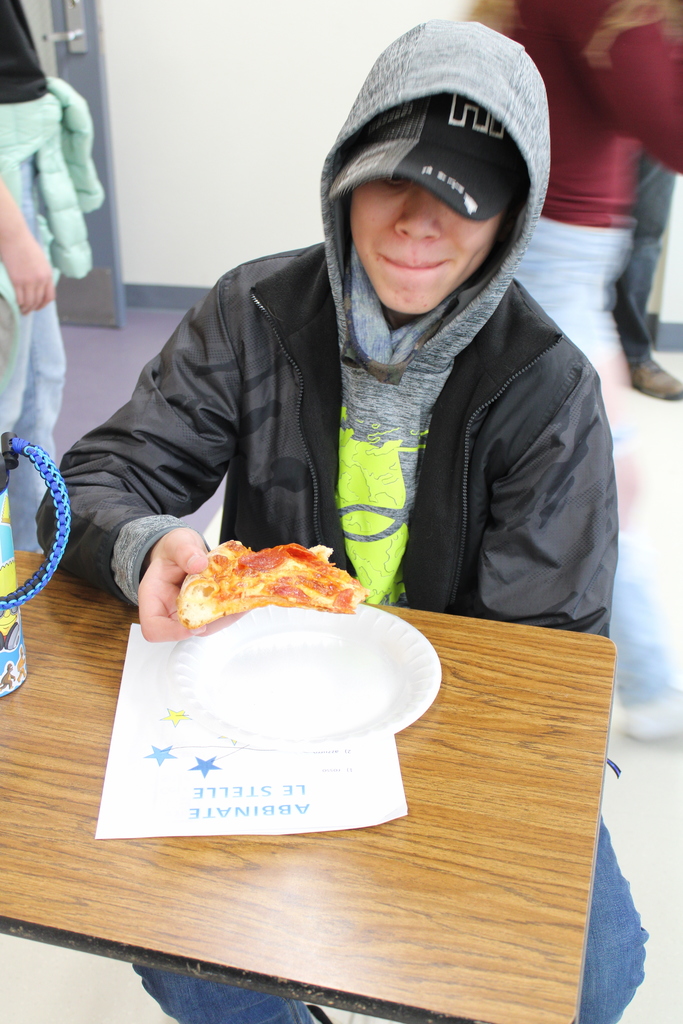 Student enjoying pizza